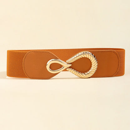 Correa elástica con broche frontal metálico dorado en diseño tipo infinito.