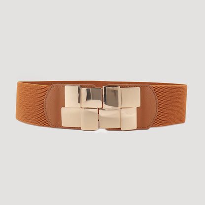 Correa elástica con broche frontal metálico en diseño de bloques.