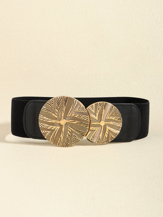 Correa elástica negra con broche frontal de discos metálicos dorados con diseño texturizado.