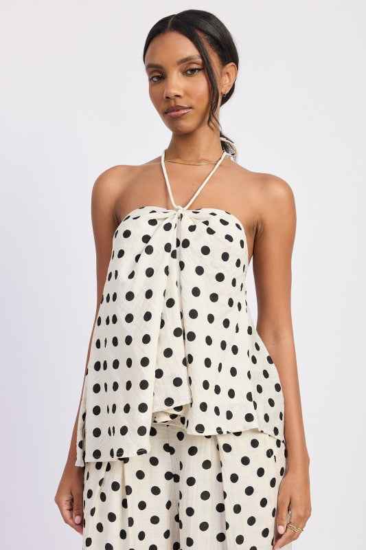 Set de dos piezas con estampado clásico, blusa halter y pantalón de pierna ancha con ajuste cómodo.
