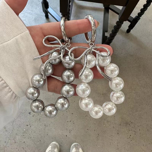 Pearl bow bag pendant